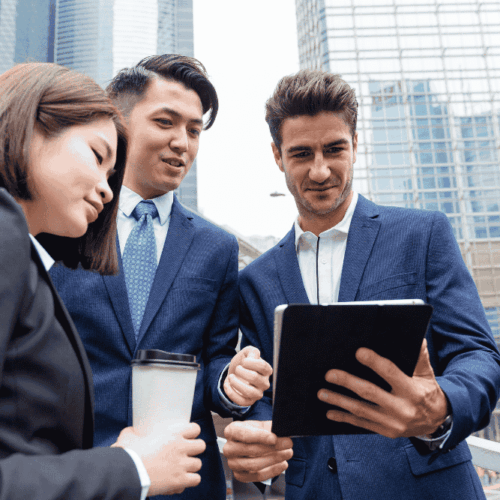 Business team collaborating remotely using QuickBooks cloud hosting on multiple devices