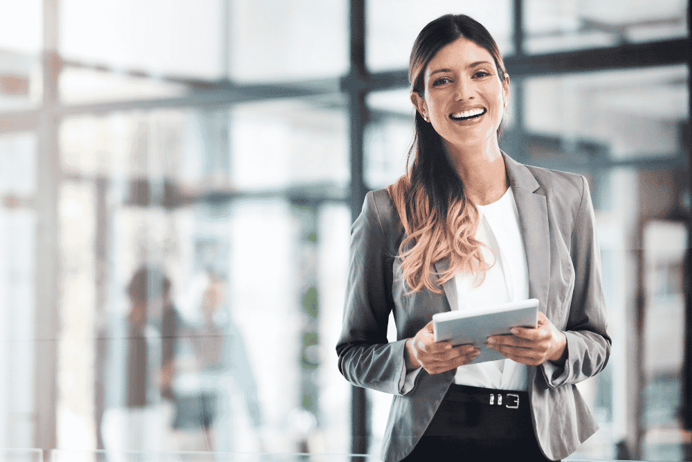 Business professional accessing QuickBooks accounting software remotely through cloud hosting services on laptop from modern workspace